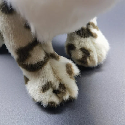 Wildlife stuffed animal snow leopard on display shelf