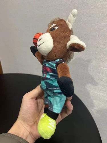 Will Harris plush displayed on shelf next to other collectibles, 24cm scale roarball plush toy

