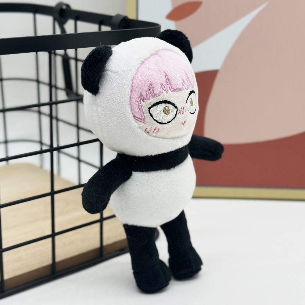 You and I Are Polar Opposites merchandise Suzuki plush on desk display
