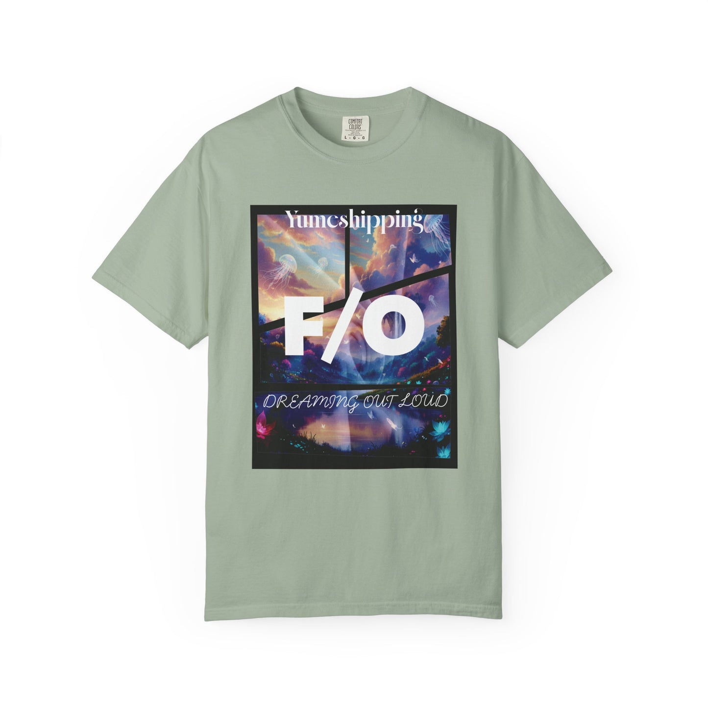 Yumeshipping shirt flat lay showing full dreamscape design with pastel clouds and cursive DREAMING OUT LOUD text
