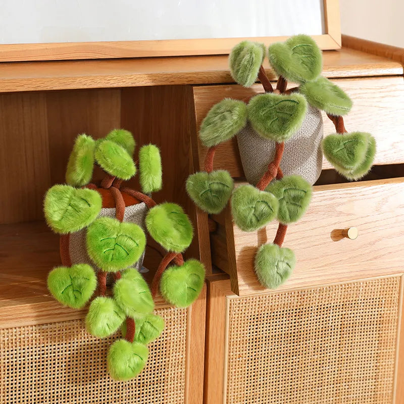 Zero maintenance fake plant decor pothos plushie on white study desk