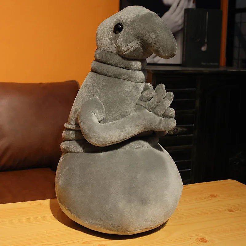 Zhdun plush toy size comparison next to hand for scale

