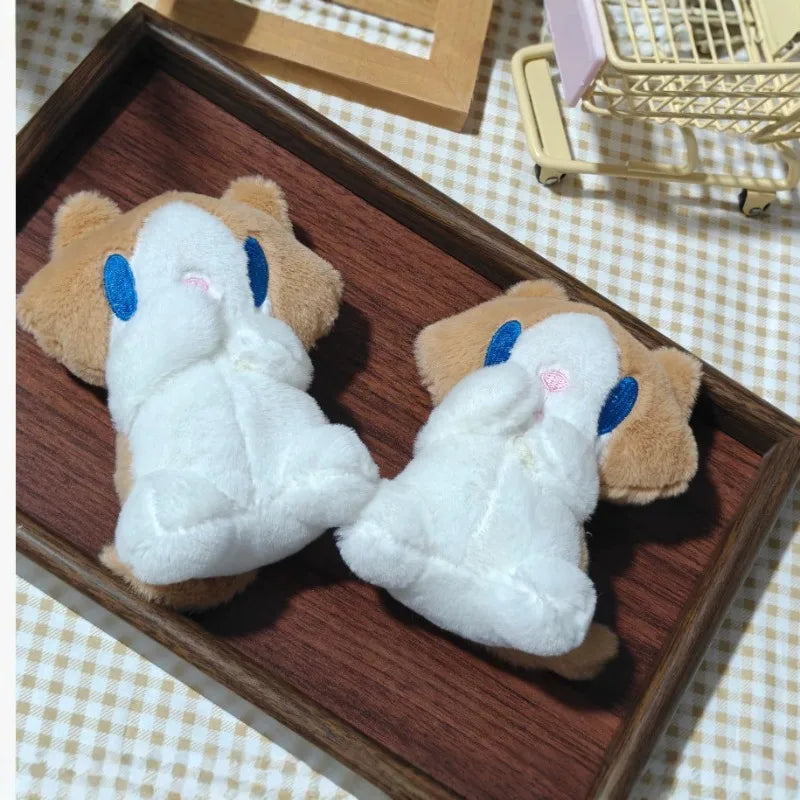 blushing ragdoll cat plush keychain displayed on white background