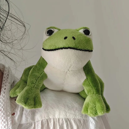 kawaii frog plushie perched on shirt collar lifestyle photo