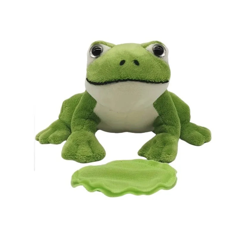 magnetic frog plush sitting on shoulder of denim jacket