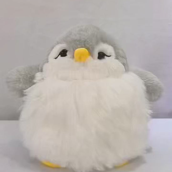 Kids penguin toy featuring rigid flipper details and a bright orange beak.