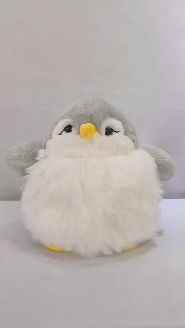 Kids penguin toy featuring rigid flipper details and a bright orange beak.
