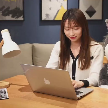 Bombastic Side Eye Cat Plush Doll in car seat - showcasing its versatility.