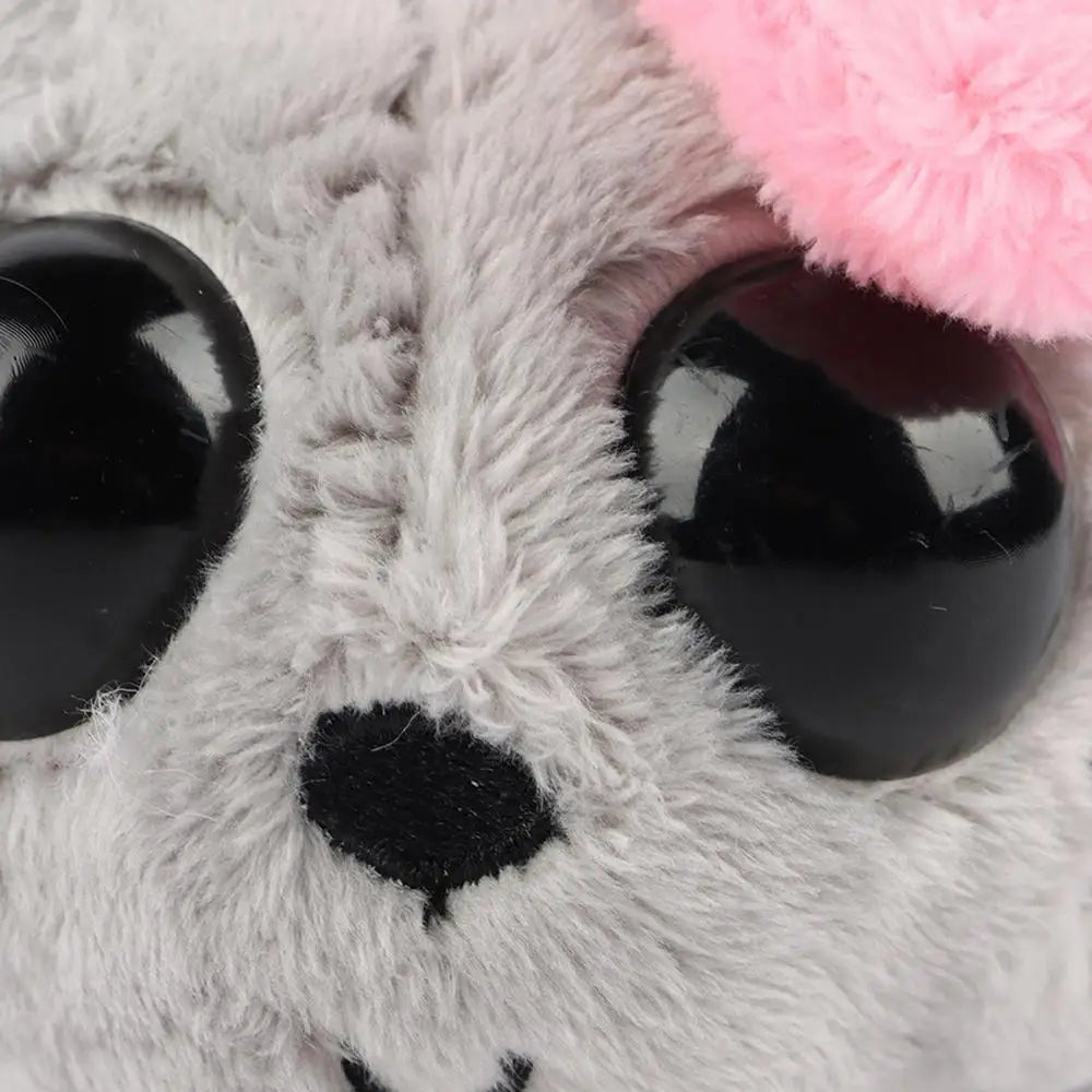 sad hamster stuffed animal sitting on white background
