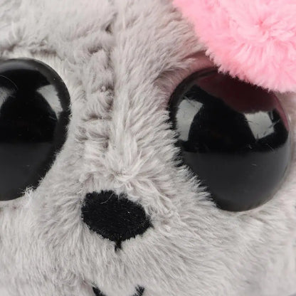 sad hamster stuffed animal sitting on white background
