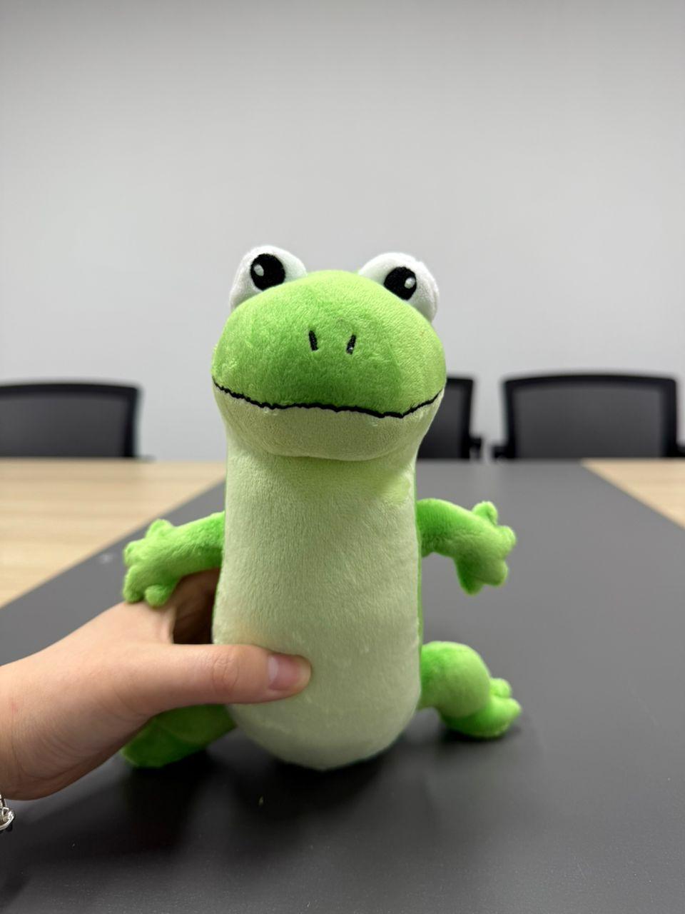 tom lizard plush displayed on a modern bedside table